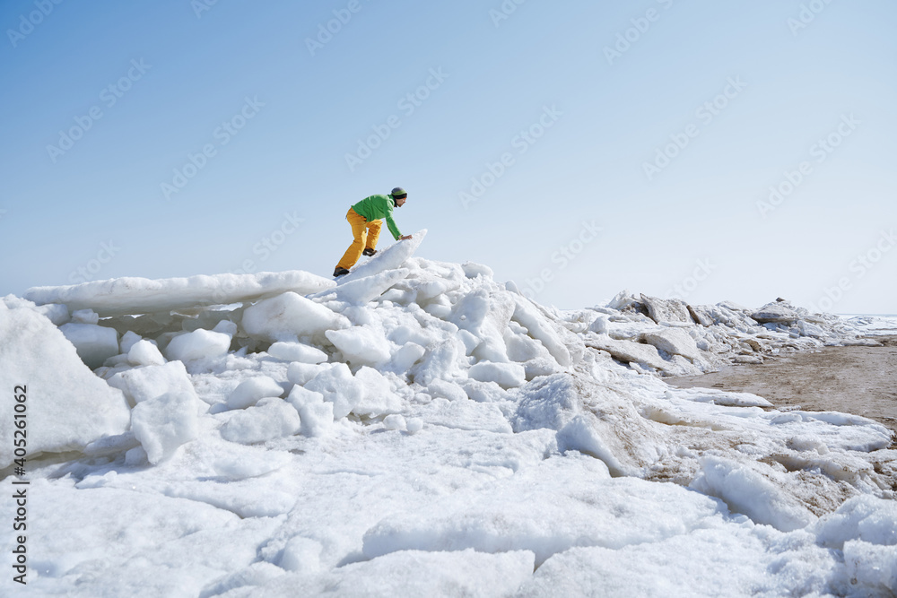 Young adult outdoors man exploring icy landscape