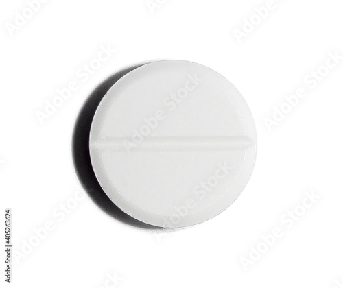 White tablet on an isolated background. Medicine and vitamin for disease and disease prevention. Close-up.