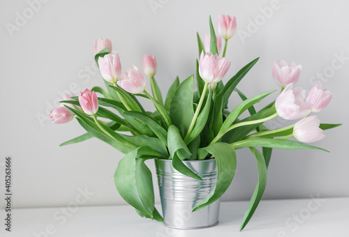 Spring white tulips in an abstract vase on the shelf, interior room #405263666