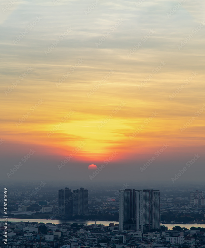 Bangkok, Thailand - Jan 10, 2021 : Aerial view of Amazing beautiful scenery view of Bangkok City skyline and skyscraper before sun setting creates relaxing feeling for the rest of the day. Evening tim