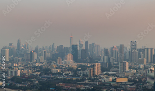 Bangkok, Thailand - Jan 13, 2021 : Aerial view of Beautiful scenery view of Skyscraper Evening time before Sunset creates relaxing feeling for the rest of the day. Selective focus. © num