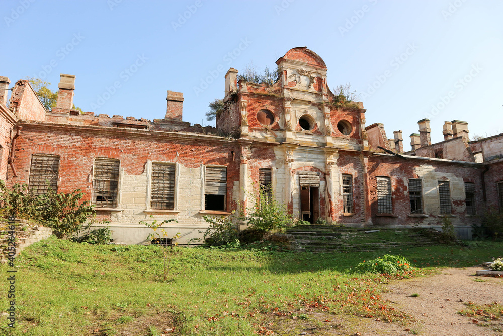 romantic ruins of beautiful old abandoned manor in the park