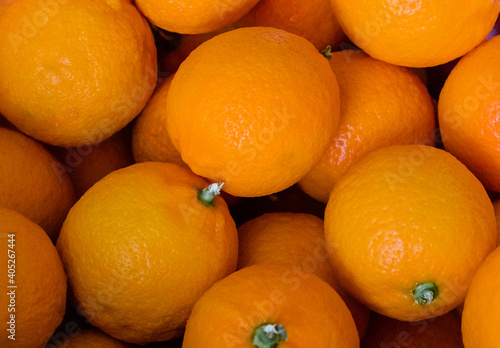 Fresh tangerine or tangerine fruits as horizontal background