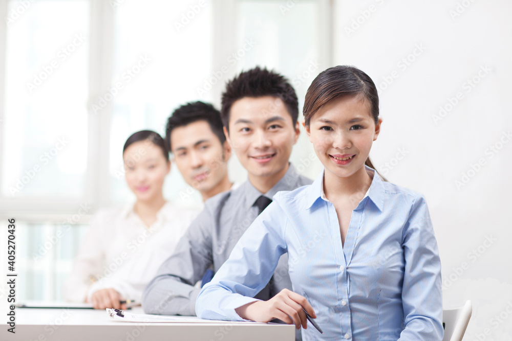 Group of business people sitting at conference table Group of business people sitting at conference table
