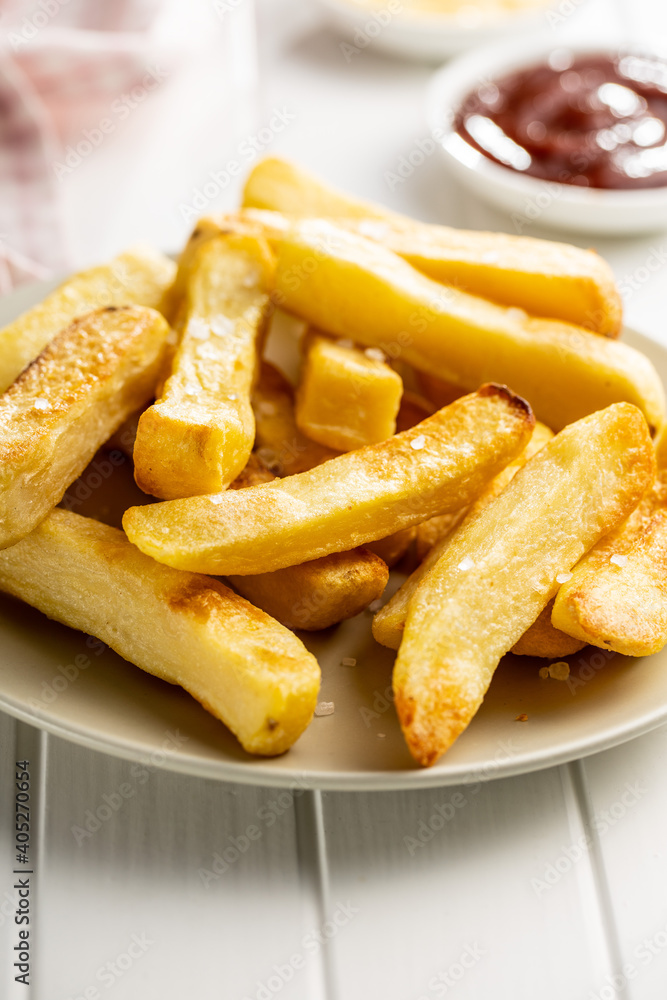 Big french fries. Fried potato chips. Big french fries. Fried potato chips.