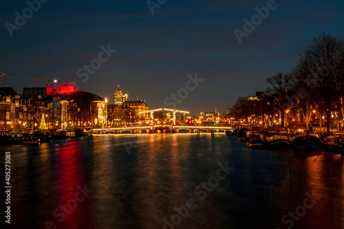 Tiny bridge in Amsterdam the Netherlands at sunset at the Amstel