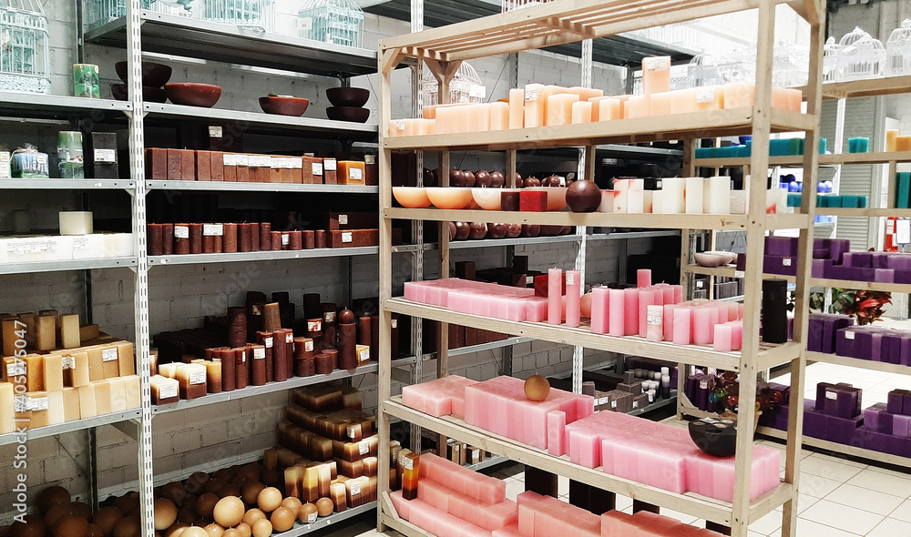 Shelves with wax candles in the interior of a home goods store. 13 January 2021, Minsk, Belarus