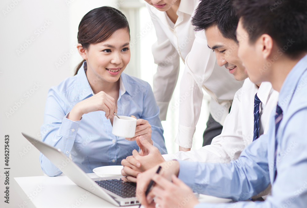 Group of business people discussing in office Group of business people discussing in office