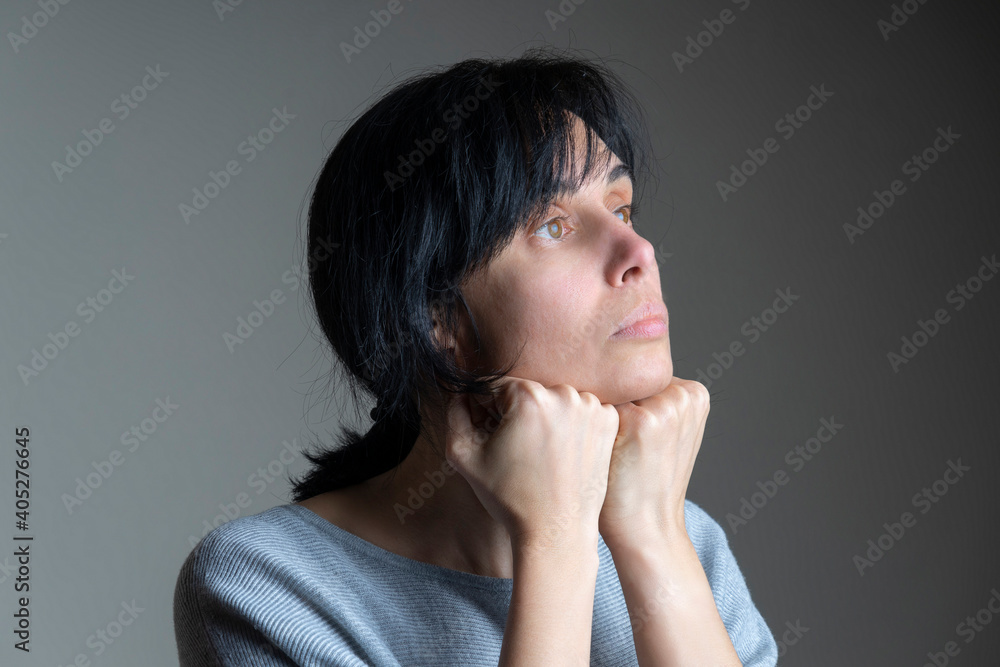 Face yoga, facial gymnastics, daily self care routine. Middle age caucasian woman performing facial exercises at home Face yoga, facial gymnastics, daily self care routine. Middle age caucasian woman performing facial exercises at home