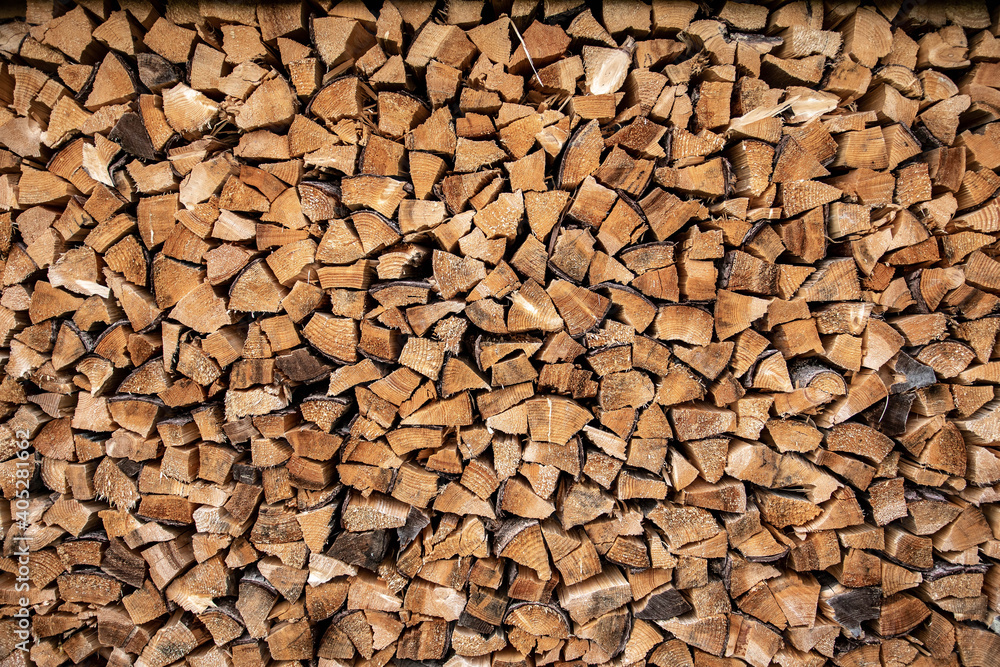 Firewood arranged neatly. Texture for backgrounds.