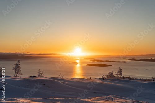 Sunrise in mountain forest with lake
