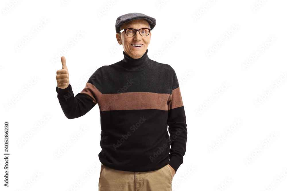 Mature fashionable man standing and showing thumbs up Mature fashionable man standing and showing thumbs up