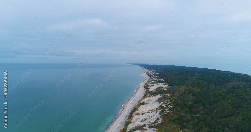 Curonian Spit, a saber-shaped sandy land strip separating the Curonian Lagoon from the Baltic Sea., Kaliningrad, Russia. Aerial panoramic view. Skyscrapers from the Drone, autumn	
