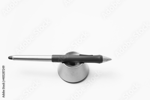 Close-up of stylus pen for graphic tablet on white background.