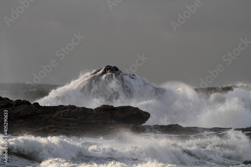 Wave breaking over cliff