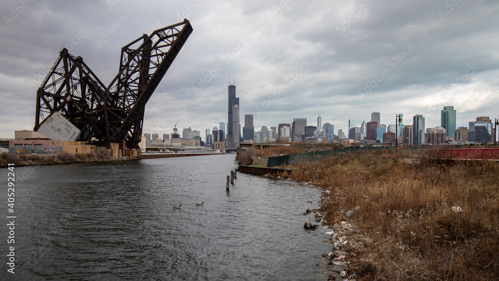 Chicago, Illinois, USA - December 23 2020: Chicago skyline with St. Charles Air Line Bridge. View from Ping Tom memorial park. 