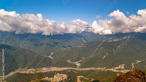 View of the mountains, overgrown with dense deciduous and coniferous forests, beautiful at any time of the year, with modern transport and economic communications for the active recreation of people