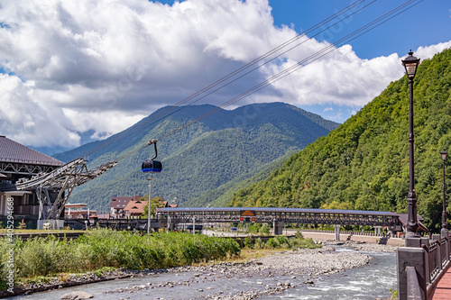 View of the mountains, overgrown with dense deciduous and coniferous forests, beautiful at any time of the year, with modern transport and economic communications for the active recreation of people