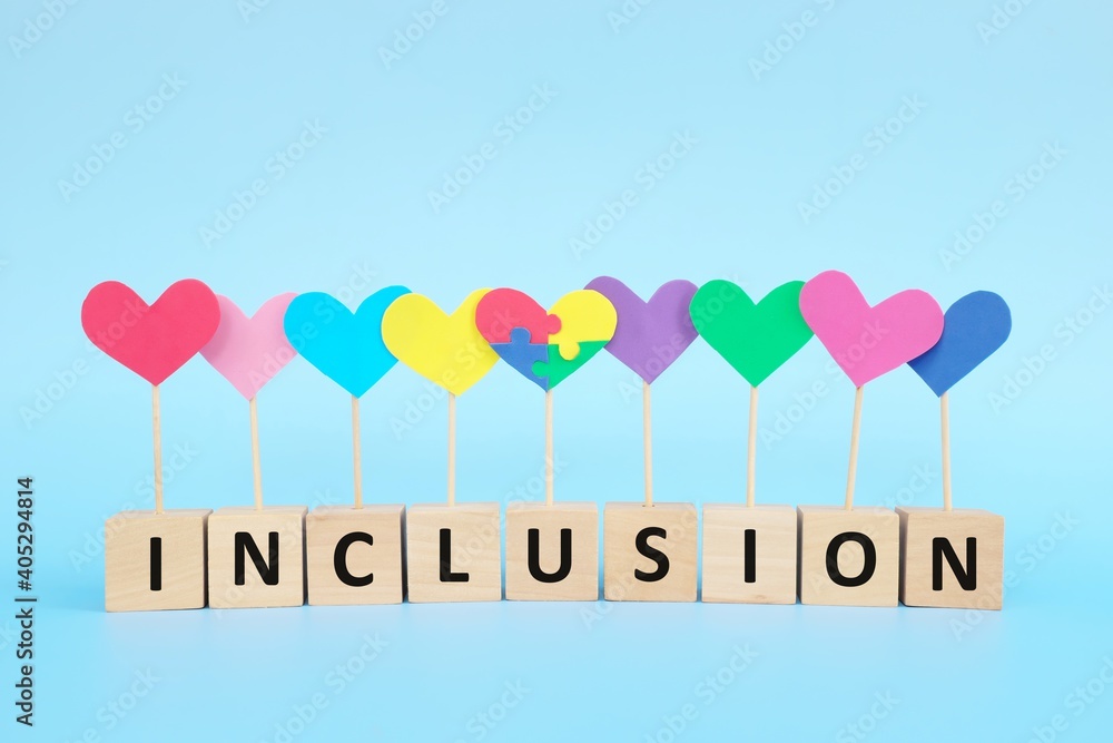 Concept of child with autism spectrum disorder equality, diversity and inclusion in society. Puzzle heart shape among multicolored group.