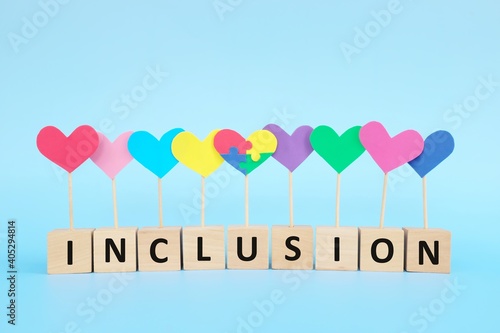 Obraz na płótnie Concept of child with autism spectrum disorder equality, diversity and inclusion in society. Puzzle heart shape among multicolored group. w salonie