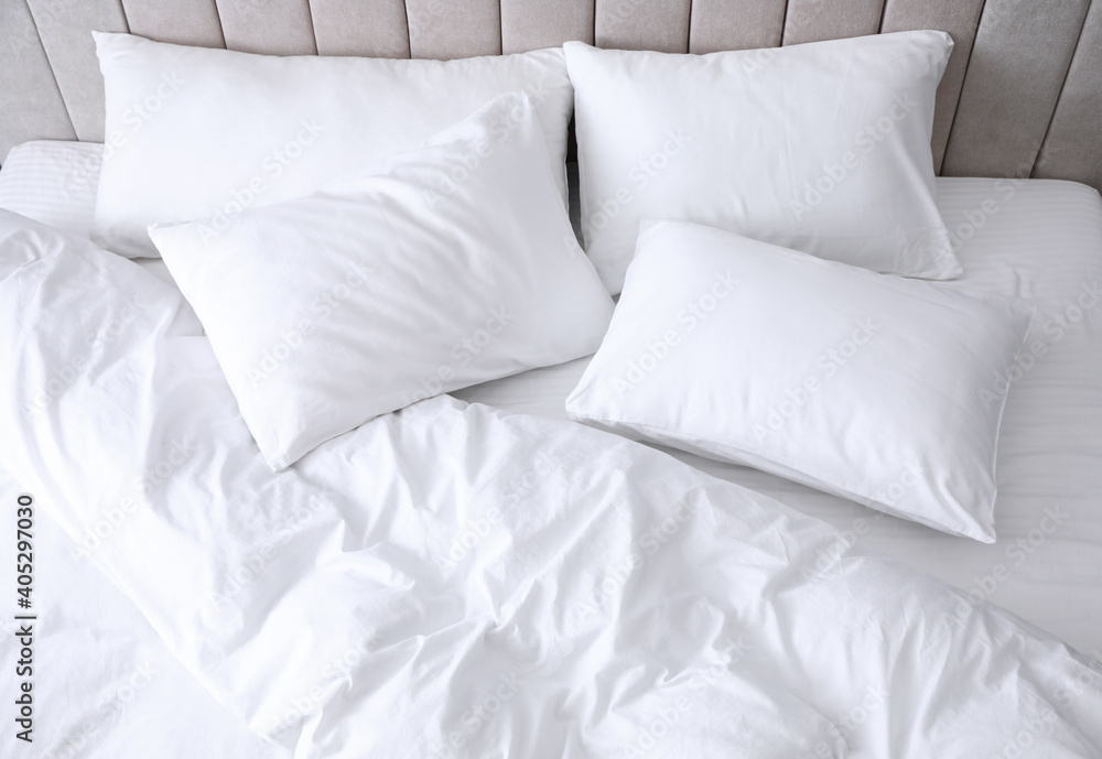 Comfortable bed with soft white pillows, closeup Comfortable bed with soft white pillows, closeup