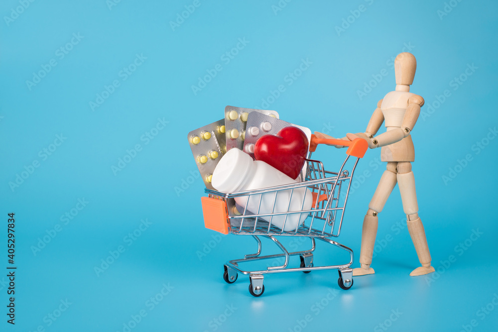 Visiting online drug store concept. Photo of wooden mannequin carrying