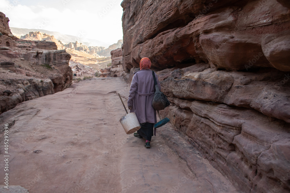 woman walking on the rocks
