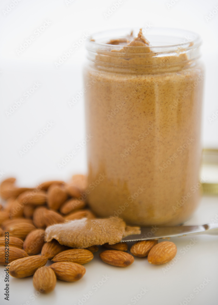 Close up almond butter and almonds Close up almond butter and almonds