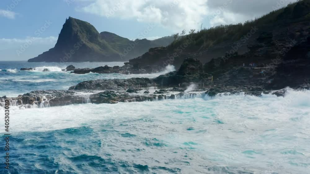 Beautiful rocky bluffs on summer day. Scenic shore volcanic sea cliffs rocks. Wild nature adventure travel, Hawaii Maui. Aerial drone flying over stormy Pacific ocean waters and cinematic coastline 4K Beautiful rocky bluffs on summer day. Scenic shore volcanic sea cliffs rocks. Wild nature adventure travel, Hawaii Maui. Aerial drone flying over stormy Pacific ocean waters and cinematic coastline 4K