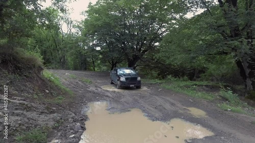 Ford F-150 off road test driving trough wild forest and mountains way. Ford f150 pickup truck in mud. Drone Aerial fly over extreme footage. Shoot date 20-08-2020
