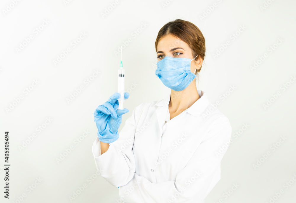 Concept fight against virus covid-19 corona virus, doctor or scientist in laboratory holding a syringe with liquid vaccines , Concept: diseases, medical care, science. Concept fight against virus covid-19 corona virus, doctor or scientist in laboratory holding a syringe with liquid vaccines , Concept: diseases, medical care, science.