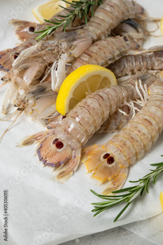 Food background mantis shrimps with lemon. Fresh seafood background. 