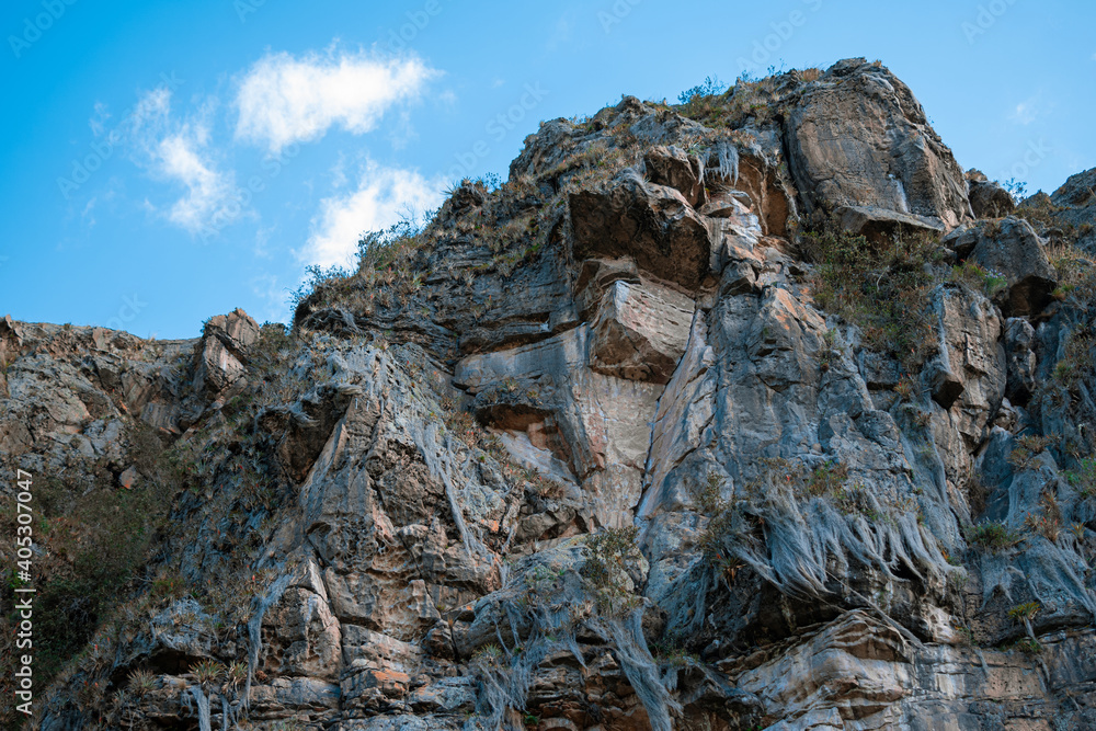 Naklejka premium Stone Walls and Rocky Mountains on a Sunny day in Suesca, Cundinamarca Colombia where many climbers go to practice
