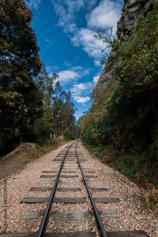Obraz premium Old Railway with rocky mountains and stone walls on a sunny day in Suesca, Cundinamarca - Colombia