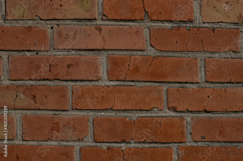 The wall is a lady of red brick.