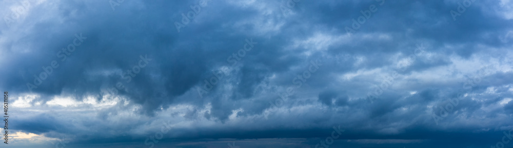 Stormy sky panorama with blue clouds before the rain. Weather forecast concept.