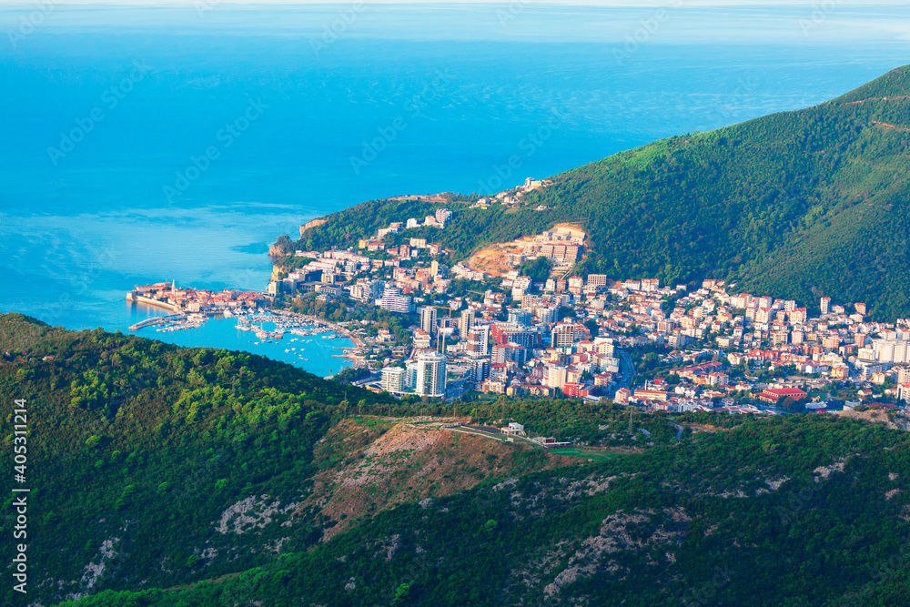 Aerial view of Budva Town in Montenegro . Panorama of Adriatic Coast and green mountains