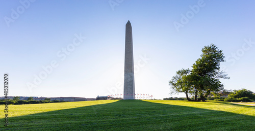 USA, Washington DC, Washington Monument casting long shadow on surrounding lawn photo