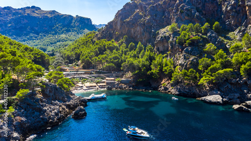 Scenic view of sea with rock mountains on sunny day, Torrent De Pareis, Sierra De Tramuntana, Mallorca, Balearic Islands, Spain
