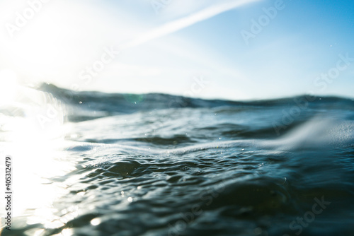 Breaking Waves and spray, white water and light reflected on the surface of the water © Christoph Burgstedt