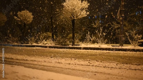 Wallpaper Mural Heavy snowfall and cars driving on street. snow under night light in city Torontodigital.ca