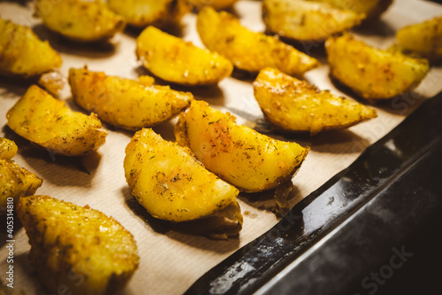 Baked potatoes in the oven close-up