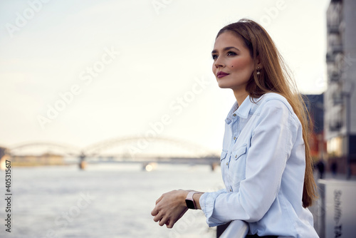 Thoughtful entrepreneur looking at view while leaning on railing