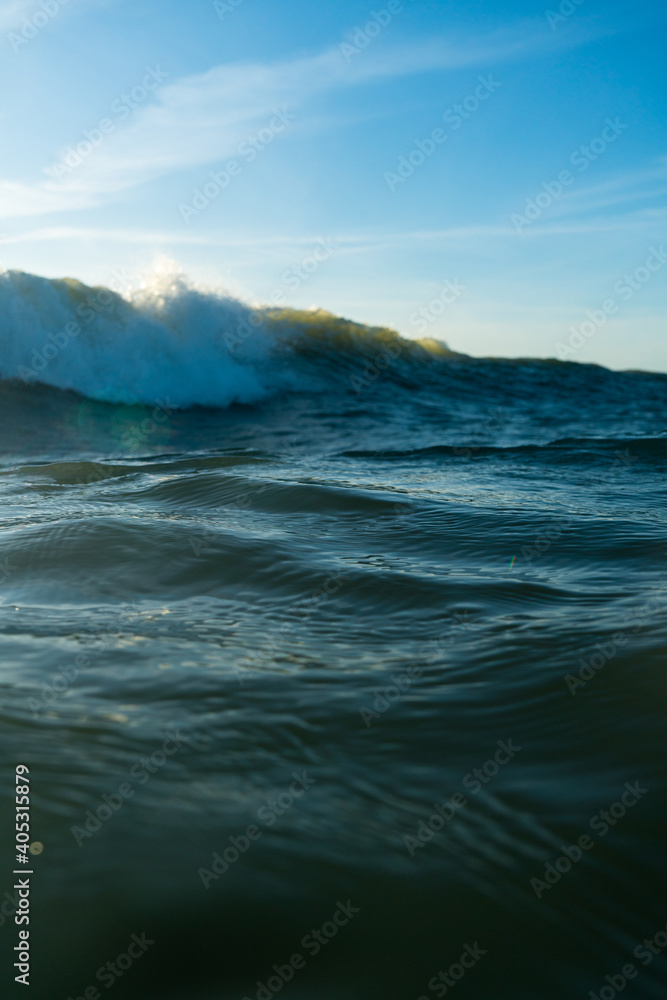 Breaking Waves and spray, white water and light reflected on the surface of the water Breaking Waves and spray, white water and light reflected on the surface of the water