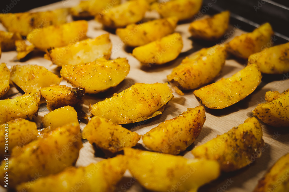 Baked potatoes in the oven close-up Baked potatoes in the oven close-up
