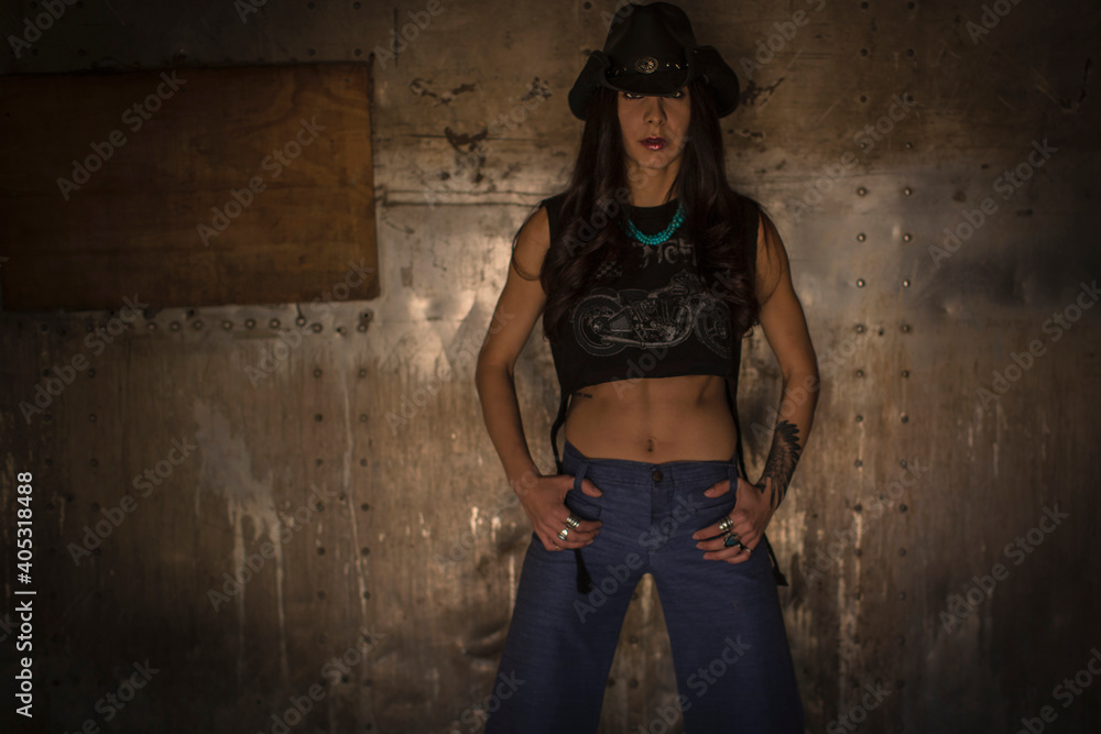Cowgirl posing in barn Cowgirl posing in barn
