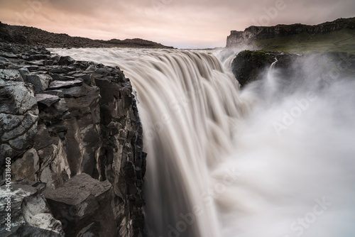 Dettifoss waterfall in pink evening glow, North Iceland photo