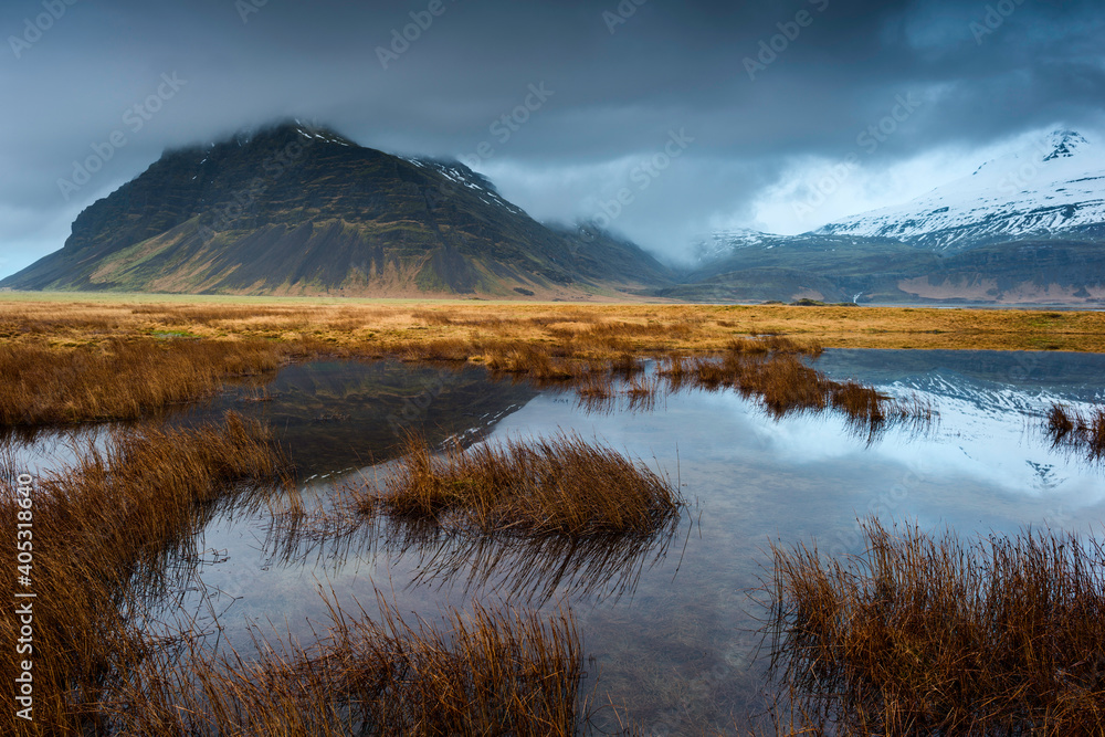 Pond in Sudursveit, Austur-Skaftafellssysla, Mount Fellsfjall in background, Southeast Iceland Pond in Sudursveit, Austur-Skaftafellssysla, Mount Fellsfjall in background, Southeast Iceland