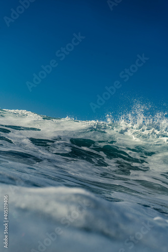 Breaking Waves and spray, white water and light reflected on the surface of the water © Christoph Burgstedt