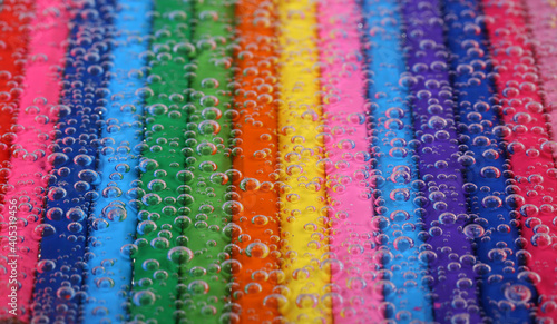 Colored pencils stacked and make a colorful rainbow